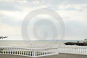 Panorama of the promenade with a parapet on a Sunny day by the sea.