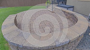 Panorama Puffy clouds at sunset Outdoor patio of a house with curved brick wall and flooring