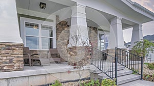 Panorama Puffy clouds at sunset Traditional contemporary home exterior with front yard landscape