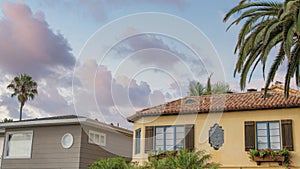 Panorama Puffy clouds at sunset Two houses with mediterranean and traditional design at La Jolla