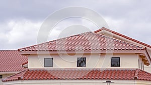 Panorama Tiled roof on a building with ventilation windows