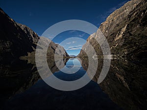 Panorama reflection of andean alpine mountain lake Laguna Chinancocha Llanganuco Huaraz Yungay Ancash Peru