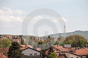 Panorama of Resnik district, a suburban residential area , with Avala toranj tower in background with individual residential house photo