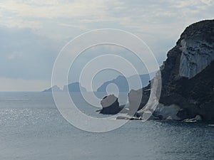 Panorama of rocks in a silvery sea to Ponza in Italy.