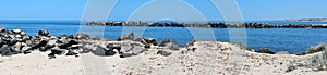Panorama of rocky fishing groynes at the Cut West Australia