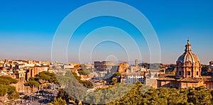 Panorama Rome Italy, sunset city Colosseum ruins Roman Forum from square of Venice