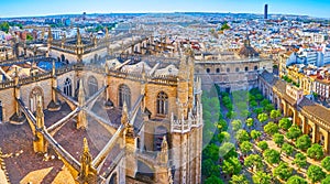 Panorama with roof of Gothic Seville Cathedral, Orange Trees Garden and Casco Antiguo, Spain