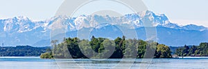 Panorama of Roseninsel rose island with bavarian alps in the background