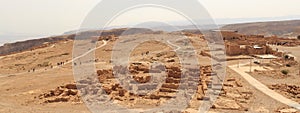 Panorama with ruins of palace and fortress Masada on Judaean Desert rock plateau, Israel