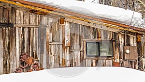 Panorama Rustic cabin with brown wooden walls in Park City Utah mountain in winter