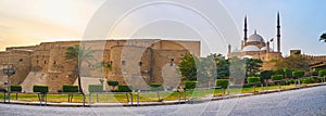 Panorama of Saladin Citadel with preserved medieval wall, huge towers, rising Alabaster mosque and ornamental garden around the