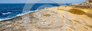 Panorama of Salt evaporation ponds, also called salterns or salt pans located near Qbajjar on the maltese Island of Gozo.