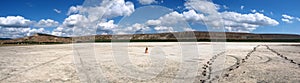 Panorama of a salt lake with a naked girl