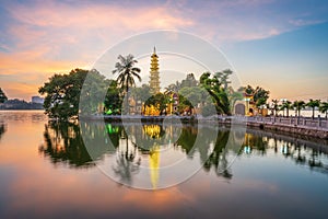 Panorama scene of Tran Quoc pagoda, the oldest temple in Hanoi, Vietnam, with brilliant sunset