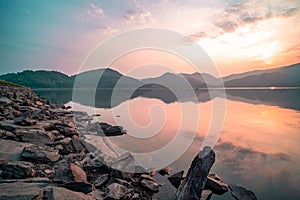 Panorama scenic of mountain lake with perfect reflection at sunrise