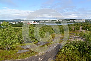 Panorama of the Semenovsky lake and inhabited residential district of the city of Murmansk