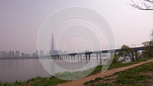 Panorama on Seoul Lotte World Tower, Hun River and Jamsil Railway Bridge