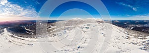 Panorama Sheregesh ski resort in winter, landscape on mountain and hotels, aerial top view Kemerovo region Russia