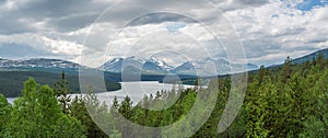 Panorama shot of Rondane national park and mountain peaks from Sohlbergsplassen viewpoint.