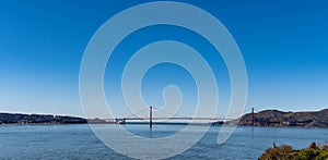 Panorama shot of the San Francisco California Downtown Skyline and Golden Gate Bridge from Alcatraz viewing deck