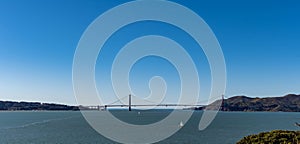 Panorama shot of the San Francisco California Downtown Skyline and Golden Gate Bridge from Alcatraz viewing deck