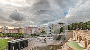 Panorama showing aerial view of Jardim da Alameda in Lisbon with the Luminous Fountain timelapse during sunset. photo