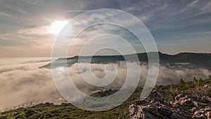 Panorama showing aerial View of Sesimbra Town and Port covered by fog timelapse, Portugal.