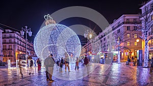 Panorama showing Christmas decorations with big ball on Luis De Camoes square night timelapse.