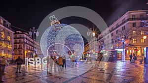 Panorama showing Christmas decorations with big ball on Luis De Camoes square night timelapse. photo