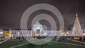 Panorama showing Commerce square illuminated and decorated at Christmas time in Lisbon night timelapse. Portugal