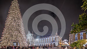 Panorama showing Commerce square illuminated and decorated at Christmas time in Lisbon night timelapse. Portugal