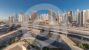 Panorama showing Dubai Marina skyscrapers and Sheikh Zayed road with metro railway, United Arab Emirates