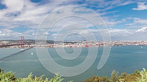 Panorama showing Lisbon cityscape and Tagus river timelapse with 25 of April bridge