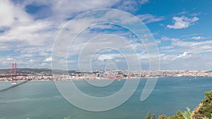 Panorama showing Lisbon cityscape and Tagus river timelapse with 25 of April bridge