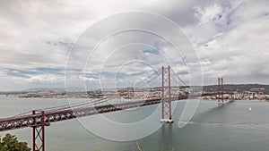 Panorama showing Lisbon cityscape and Tagus river timelapse with 25 of April bridge