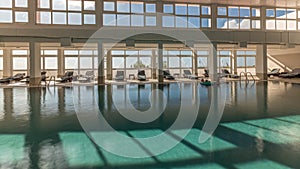 Panorama showing luxury indoor swimming pool, part of hotel timelapse