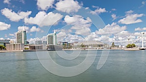 Panorama showing Parque das Nacoes or Park of Nations district timelapse in Lisbon, Portugal.
