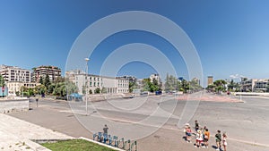 Panorama showing traffic on the Deshmoret e Kombit Boulevard in Tirana timelapse.