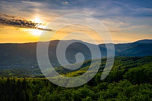 Panorama of the Silesian Beskids from Rownica peak at sunrise. Poland