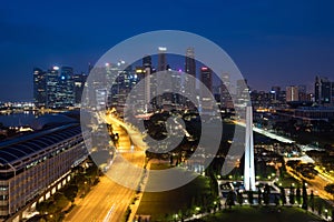 Panorama of Singapore business district skyline and skyscraper with War Memorial Park in night at Marina Bay, Singapore. Asia