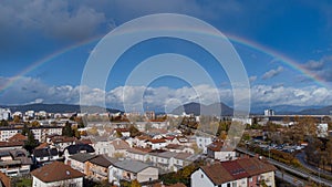 Panorama of siska district in Ljubljana, Slovenia accompanied by beautiful rainbow spanning over the horison over the Smarna Gora