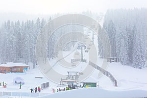 Panorama of ski resort Kopaonik, Serbia, skiers, lift, pine trees