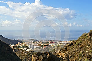 Panorama of a small Spanish city in Tenerife from above near the sea, natural background