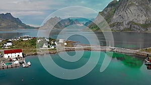 Panorama of small town separated by fjords against mountains