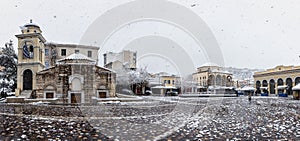 Panorama of the snow covered Monastiraki Square in the center of Athens