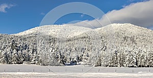 Panorama of snow covered mountain. photo