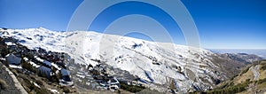 Panorama of snow mountain landscape with blue sky from Sierra Ne