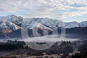 Panorama of Snow Mountain Range Landscape with Blue Sky background from New Zealand