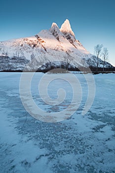 Panorama of snowy fjords and mountain range, Senja, Norway Amazing Norway nature seascape popular tourist attraction.