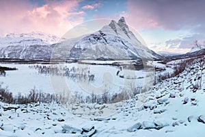 Panorama of snowy fjords and mountain range, Senja, Norway Amazing Norway nature seascape popular tourist attraction.